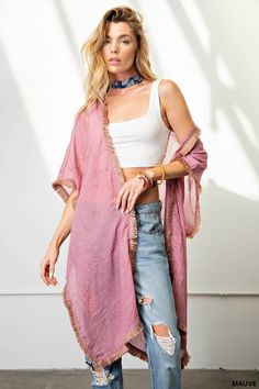 Experience the ease and elegance of our fringe trim kimono. Crafted from a light-weight, soft fabric, this versatile cover-up is perfect for any event. Perfectly suited for dressy occasions and both day and night events, the kimono offers a flattering, loose fit that can be dressed up or down, worn over shorts, jeans, or a beautiful dress. Enjoy the fun and beauty of the fringe trim for an effortless look. Chic Spring Unlined Cover-up, Chic Spring Layering Cover-up, Chic Unlined Spring Cover-up, Chic Wrap Cover-up For Spring, Spring Cotton Kimono For Beach Cover-up, Long Spring Loungewear Cover-up, Chic Spring Loungewear Kimono, Fringe Kimono For Beach In Fall, Fall Beach Kimono With Tassels