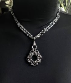 A bold statement of Norse style and power, this handmade Viking Chain Chainmail Necklace is sure to turn heads! Crafted with stainless steel, this gorgeous necklace won't tarnish and will stay looking stunning no matter your adventure. Choose your length to pair with any outfit, from choker to long necklace. Embrace your inner Viking or Gothic queen with this one-of-a-kind piece! Black Stainless Steel Chainmail Jewelry, Gothic Stainless Steel Chain Necklace, Handmade Silver Gothic Chain Necklace, Gothic Chainmail Jewelry Gift, Gothic Gunmetal Chain Jewelry, Gothic Gunmetal Jewelry With Chain, Punk Black Chain Necklace With Silver Chain, Punk Style Black Chain Necklace With Silver Chain, Punk Black Necklace With Silver Chain