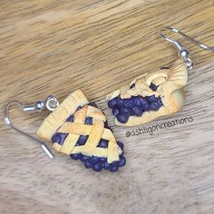 Blueberry Pie Earrings Blueberry Pies measure approximately between 1.5cm to 2.25cm Materials: ▫ Polymer Clay ▫ Hypoallergenic Hanging Earring Hook Each Blueberry Pie is handmade by me, so you may receive a pair of earrings that are slightly different from the ones pictured in the listing. As they are all made by hand all are similar but no two pairs will ever be the same! I can also do custom orders. Please feel free to send me a message with any questions or ideas! Thanks for checking out my s Pie Board, Blueberry Earrings, Turtle Ice Cream, Blueberry Pies, Pie Earrings, Mango Earrings, Dnd Inspiration, Hanging Earring, Cream Earrings