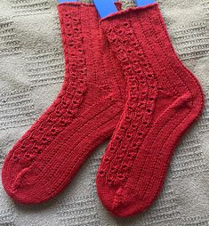 This listing is for a pair of Ruby Red Cable Lace Rib Socks. Spin2Knit artisan-made hand knit socks:  - exceptionally comfortable, warm, and wear well.  - hand knit by me with care and precision right here in my studio. - SLOW-MADE fashion... taking about 45 hours of hand knitting. Socks make great GIFTS!  - Everyone enjoys a cozy, warm pair of socks!  - One of the most practical accessories that everyone needs. - An excellent gift for someone who appreciates natural materials and the uniqueness of a handmade item. - Hand knit socks keep your feet nice and warm yet still allow air circulation. ::SIZE::  Foot length: 8.5 to 10.5 inches comfortably Leg from top leg edge down to heel: 8 inches Wool stretches a bit and will conform to your foot as you wear it. ::YARN:: These socks are made fro Handknit Socks, Practical Accessories, Fashion Movement, Hand Knit Socks, Air Circulation, Red Lace, Socks And Hosiery, Knit Socks, Ruby Red