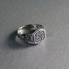 SKU: 30329 Celtic Shield Knot on the top and Thor's symbols on both sides of the rings. Features: Brand new sterling ring silver 925. Not plated, 100% solid silver metal! Approx weight of the product - 6.0 g.; Top size of the ring - 11x11 mm; Processing - 1) blackening by oxidation 2) Shine rhodium plated Availability of proprietary tag manufacturer - Yes; Manufacturing and country of origin - Ukraine; online shop - www.indigo.jewelry e-cataloque - www.indigo.gold Classic Silver Signet Ring With Maker's Mark, Thor Symbol, Shield Knot, Celtic Shield Knot, Indigo Jewelry, Celtic Shield, Thor Hammer, Measure Ring Size, Signet Rings