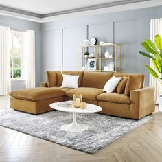 a living room filled with furniture and a large rug