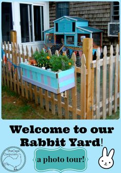 a sign that says welcome to our rabbit yard with a photo of a house in the background