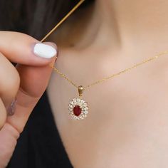 Make A Lasting Impression With Our Breathtaking Lab Grown Diamond And Ruby Halo Pendant Necklace, Made From 18k Yellow Gold Yellow Gold Ruby Necklace With Diamond Cut, Gold Ruby Necklace Fine Jewelry, Fine Gold Ruby Necklaces, Fine Gold Ruby Necklace, Luxury Ruby Necklace In Yellow Gold, Oval Ruby Necklace In Yellow Gold, Exquisite Hand Set Yellow Gold Necklace, Hand-set 14k Yellow Gold Necklace, Exquisite Yellow Gold Necklace Hand Set