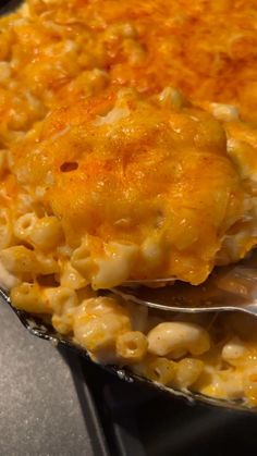 a close up of a plate of food with macaroni and cheese on it