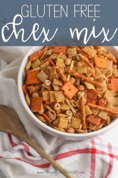 a white bowl filled with chex mix on top of a red and white checkered towel