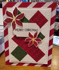 a christmas card with red, green and white plaid paper on the bottom that says merry christmas