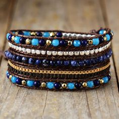 Introducing the Ethnic Blue Chic Wrap Bracelet, a stunning accessory that brings beauty and harmony to your daily life. Crafted with high-quality gemstones, this bracelet exudes a sense of elegance and sophistication, making it a perfect complement to any outfit. Not only does it enhance your appearance, but it also promotes balance and positive energy flow throughout your body. *Material: Jasper, Lapis Lazuli, Jade, Wax rope, Metal *Making Technics: Handmade Sewed *Size: 32.5 inches, 3 closures Bohemian Sapphire Round Bead Jewelry, Bohemian Sapphire Gemstone Beads Jewelry, Bohemian Blue Gemstone Jewelry, Bohemian Sapphire Beaded Jewelry, Elegant Blue Hand-strung Crystal Bracelet, Elegant Adjustable Blue Crystal Bracelet, Adjustable Lapis Lazuli Beaded Bracelets Bohemian Style, Adjustable Lapis Lazuli Beaded Bracelets With Gemstone, Bohemian Blue Beaded Bracelets For Meditation