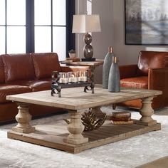 a living room with two couches and a coffee table in it's center