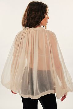 Sheer perfection, this timeless blouse is featured in a classic billowy design with vintage-inspired cinched neckline for added dimension. **Fit:** Oversized, billowy fit **Features:** Sheer gauzy fabrication, ruffle trimming at the neckline, tie-front bow feature, banded sleeves **Why We ❤ It:** Sultry with made-to-be-seen intimates or perfect for layering with a seamless turtleneck, this style has endless ways to wear. | Chiffon Bow Top by Free People in White, Size: M Ruffle Chiffon Blouse, Chiffon Bow, Open Blouse, Bow Top, Chiffon Ruffle, Satin Blouse, Chiffon Blouse, Blouse Styles, Boho Clothing