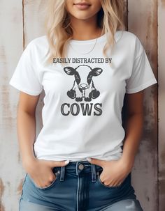 Easily Distracted By Cows Shirt, Cow shirt, Funny Cow Shirt, Farm Life Shirts, Farm Animal Tee,Cute Cow Shirt, Farm Animal Tee, Farming Gift Welcome to DJ swag shop. Looking for soft, comfy, colorful high quality shirts. You've picked the right shop.  All of our shirts are made to order.  All shirts come pre-washed in a gentle detergent. If you would like colors or writing styles changed we will do our best to accommodate you.  You can always send us a message with any questions, comments or con Funny Baby Shirts, Cat Dad Shirt, Funny Toddler Shirt, Funny Coffee Shirts, Cute Christmas Shirts, Cow Shirt, Cows Funny, Dog Mom Shirt, Matching Tees