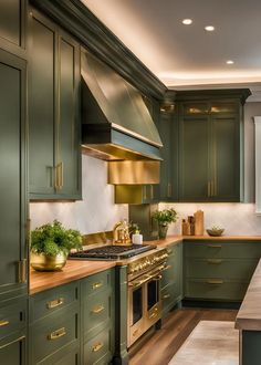 a kitchen with green cabinets and gold accents