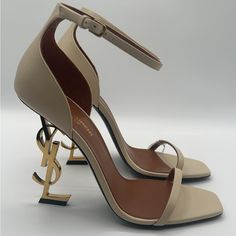 Saint Laurent Opyum Ysl Sandals With Cassandre Heel Condition: New In Box, Guaranteed Authentic Available In Multiple Sizes Heel Height: 4.3” (110mm) Color: Real Beige Calfskin Leather Upper / Leather Lining / Leather Sole Comes With Original Box, Authenticity Card, And Dust Bag Msrp $1,290 + Tax Made In Italy Ysl Sandals, Yves Saint Laurent Shoes, Beige Heels, Saint Laurent Shoes, Shoe Game, Leather Heels, Shoes Women Heels, Yves Saint Laurent, Calf Skin