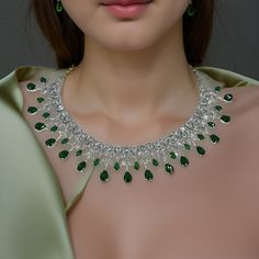 "Real looking AAA cubic zirconia and emerald diamond necklace with an adjustable length, comes with earrings.  Dimension: 5.5\" end to end length, Earrings: 2\" long" Elegant Emerald Necklace With Jewels For Party, Elegant Emerald Necklace For Party, Sparkling Green Crystal Jewelry, Dazzling Emerald Necklace With Diamonds For Parties, Party Diamond Necklace With Crystal Detail, Elegant Crystal Emerald Necklace With Jewels, Elegant Crystal Emerald Necklace, Party Crystal Diamond Necklace, Emerald Jewelry With Diamond Accents For Party