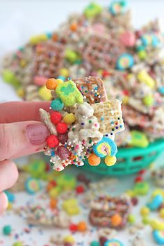 a person is holding up some kind of cereal bar with sprinkles on it