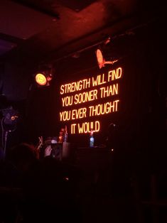 a neon sign that says strength will find you someone than you ever thought it would