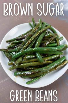 brown sugar green beans on a white plate with the title above it reads, brown sugar green beans