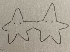 an image of two stars drawn on paper