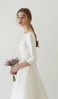 This midi dress is traced with simple line that glamorously define the nipped-in waist. Cut from lustrous ivory satin that's draped through the bodice and skirt, it has long sleeves and a full, sweeping hem. And it is an elegant and sophisticated choice for formal events. Wear it with strappy heels and a simple clutch. WHERE TO WEAR:Romantic date nights, weddings, glam functions and events, champagne bars. Material: 100% Polyester Gentle Dry Clean OnlyColour may vary due to lighting on images. T Cream Satin Dress For Banquet, White Elegant Satin Cocktail Dress, Elegant White Satin Cocktail Dress, Wedding Satin A-line Dress With Pleated Bodice, Wedding A-line Satin Dress With Pleated Bodice, A-line Satin Wedding Dress With Pleated Bodice, Sleek Satin Midi Dress For Wedding, A-line Satin Dress For Wedding, Elegant Satin Midi Dress With Pleated Back