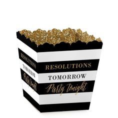 a black and white striped box with gold glitter on the lid that says resolutions tomorrow party tonight