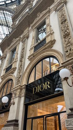 the entrance to a luxury store in an ornate building