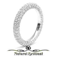 a white gold wedding ring with round diamonds on the inside and outside, set in 18k white gold