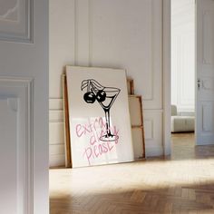 an empty room with a sign on the floor and a painting hanging in front of it