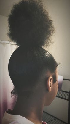 a woman with her hair in a bun