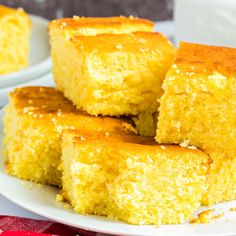 several pieces of cornbread on a white plate