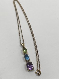 Gorgeous Gold Vermeil 925 Sterling Silver Genuine Diamond Gemstone Necklace Excellent condition Sterling silver with gold vermeil overlay. Small genuine diamonds surrounded by 3 multi-color gemstones; an amethyst, a blue topaz and a peridot. GREAT DEAL! It will look beautiful on any one who wears it! Please message me with any questions Shipped insured/delivery confirmation I guarantee item to be exactly as described and pictured. Multicolor Hallmarked Necklace For Anniversary, Multi-stone Amethyst Necklace For Anniversary, Amethyst Multi-stone Necklace For Anniversary, Black Opal Pendant, Carnelian Necklace, Initial Ring, Opal Pendants, Star Pendant, Diamond Gemstone