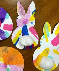 three paper plates with painted bunny faces on them