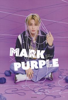 a person sitting on the ground with yarn in front of her and text that reads mark purple