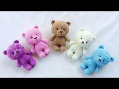 four crocheted teddy bears in different colors