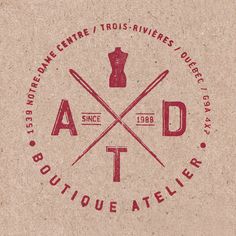 the logo for a boutique atelier is shown in red and brown paper with scissors on it