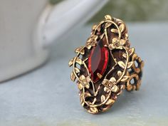 Beautiful Victorian style antiqued brass ring with sparkle ruby red Swarovski glass jewel set in center. All metal parts are brass based and are torch soldered together.    Measurement, Adjustable band that fits U.S size 6 to 10. Dark Victorian, Bijoux Art Nouveau, Neo Victorian, Dark Rose, Pink Swarovski, Fashion Jewelry Sets, Brass Ring, Victorian Jewelry, Fantasy Jewelry