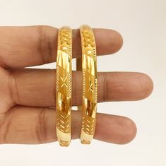 "Please contact us for any discounts or offers that are available on this item. As these gold bangles are very light in weight, after making these bangles, we put a protective metal bangle on the inner surface of the original gold bangles, as shown in the 4th image, this provides strength & shape to the bangles. Please Note:- The bangles are made out of Real Solid Gold & the metal bangles are just for support & durability. All Sizes available. We take absolute care of precious jewels Solid Gold Bangle, Metal Bangles, Gold Bangles For Women, The Bangles, Yellow Gold Bangle, Bangles Indian, 18k Gold Jewelry, Precious Jewels, Gifts For My Boyfriend