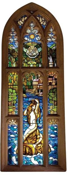 a stained glass window with a woman sitting in the water