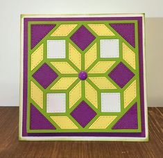 a card with a quilted design on it