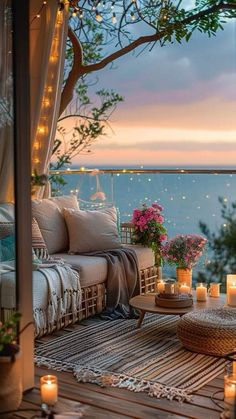 an outdoor living room with candles and flowers