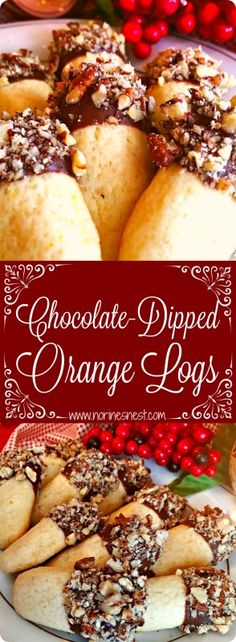 chocolate dipped orange logs on a plate with cranberries