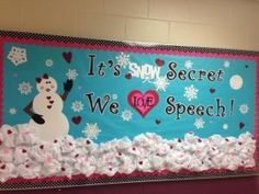 a bulletin board that says it's snow secret, we off speech with a snowman and heart