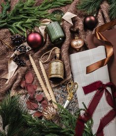 christmas decorations and gifts laid out on a blanket