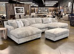 a large sectional couch in a furniture store