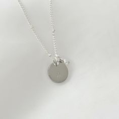 Express your unique personality with this Sterling Silver plated initial necklace that is both stylish and sentimental. The personalized initial charm sits elegantly between the collar bones, adding a polished touch to any outfit. To make this necklace even more special, it can be customised with a letter, heart or star sign of your choice. This adds a unique touch to the piece, making it a perfect gift for yourself or someone special. ♡ Handcrafted and Stamped in our Sydney Studio ♡  Natural Fr Minimalist Hypoallergenic Charm Necklaces For Anniversary, Minimalist Hypoallergenic Charm Necklace For Anniversary, Everyday Hand Stamped Initial Pendant Necklace, Everyday Minimalist Sterling Silver Name Necklace, Classic Sterling Silver Initial Pendant Name Necklace, Dainty Initial Necklace With Charms For Personalized Gift, Minimalist Sterling Silver Name Necklace For Everyday, Everyday Dainty Hand Stamped Initial Necklace, Classic Sterling Silver Initial Pendant Necklace