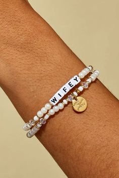 Let’s celebrate all the wifeys in our lives! Gift this handcrafted faux pearl bracelet to the girlie who’s about to wed her prince charming or the woman who’s been happily married for two decades. Part of a Bigger Story: Little Words Project is all about spreading kindness and empowerment through words. By wearing this bracelet, you become part of a larger community that shares the power of words. Bead Pattern: Bling Bling Hand-crafted, faux pearl and crystal beaded bracelet Plated Brass Hardwar Personalized White Bracelets For Party, Elegant Charm Bracelet With Letter Beads, Elegant Pearl Beaded Bracelets With Letter Beads, Party Jewelry Bracelet With Letter Beads, Party Bracelet With Letter Beads, Beaded Bracelets With Pearl Charm For Gift, Adjustable Pearl Beaded Bracelets For Anniversary, Party Letter Beads Bracelet Jewelry, Pearl White Beaded Bracelets For Wedding