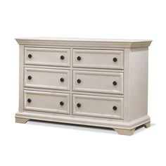 a large white dresser with six drawers