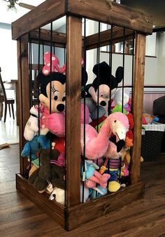 a cage filled with lots of stuffed animals