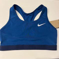 New Dri-Fit Nike With Tags Blue Nike Sports Bra For Training, Nike Blue Sports Bra For Training, Nike Blue Sports Bra For Workout, Nike Blue Activewear For Workout, Nike Sporty Blue Sports Bra, Blue Sports Bra With Medium Support, Blue Sports Bra With Medium Support For Sports Season, Blue Medium Support Sports Bra, Nike Blue Sports Bra With Moisture-wicking