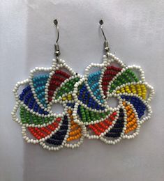 multicolored beaded earrings on white background