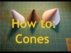 two pieces of paper sitting on top of a cutting board with the words how to cones